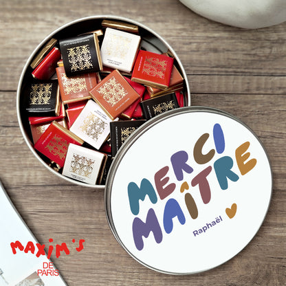Boite métallique ronde, garnie de chocolats Merci Maître photo N° 1
