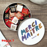Boite métallique ronde, garnie de chocolats Merci Maître photo N° 1